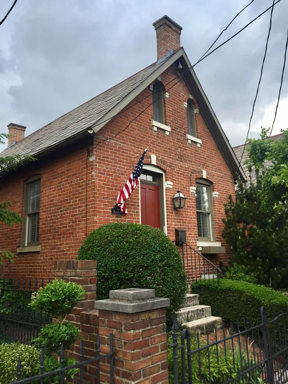 Brick house with a red door on Mohawk Street in Columbus German Village