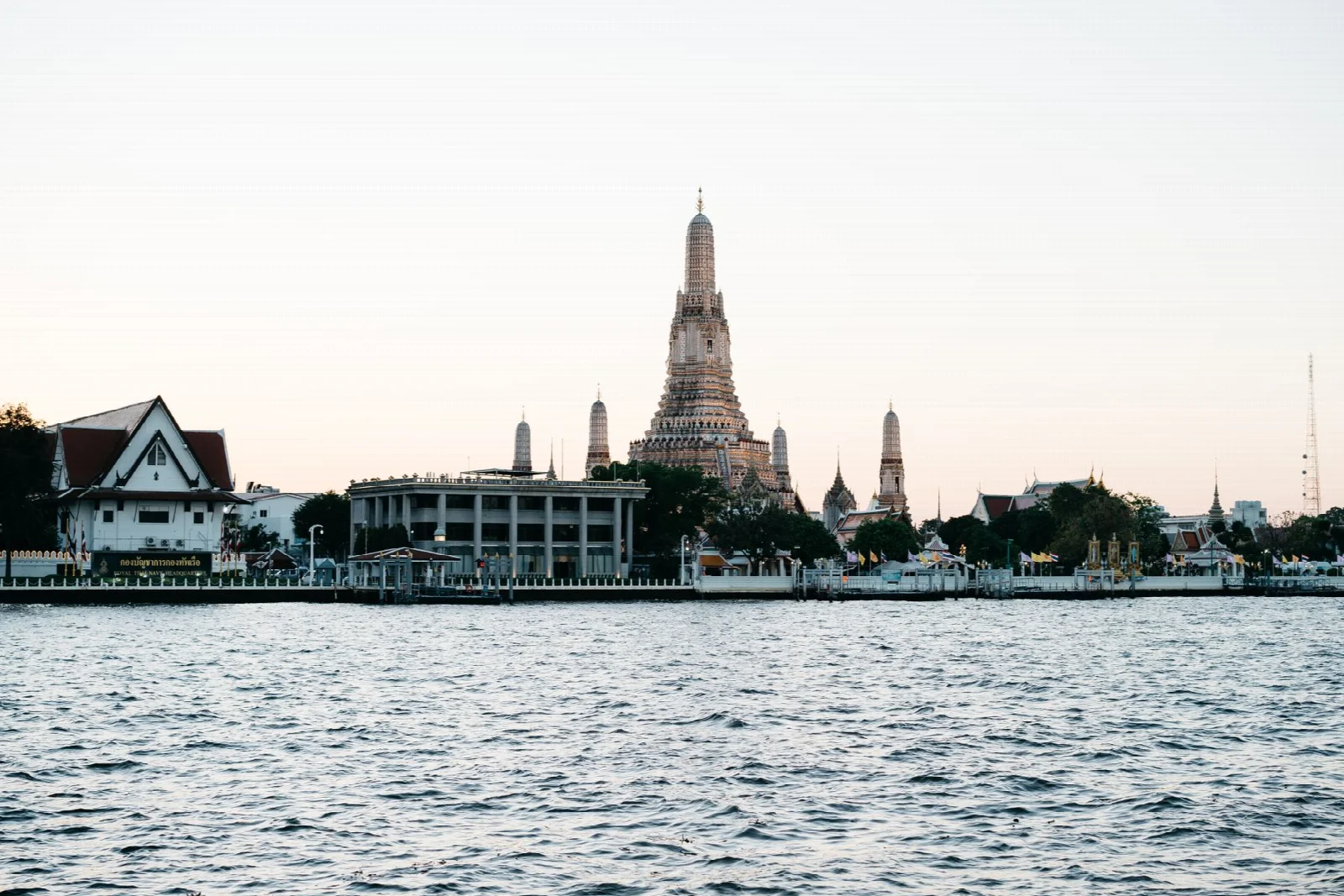Wat Arun temple beside the river in Bangkok at dusk