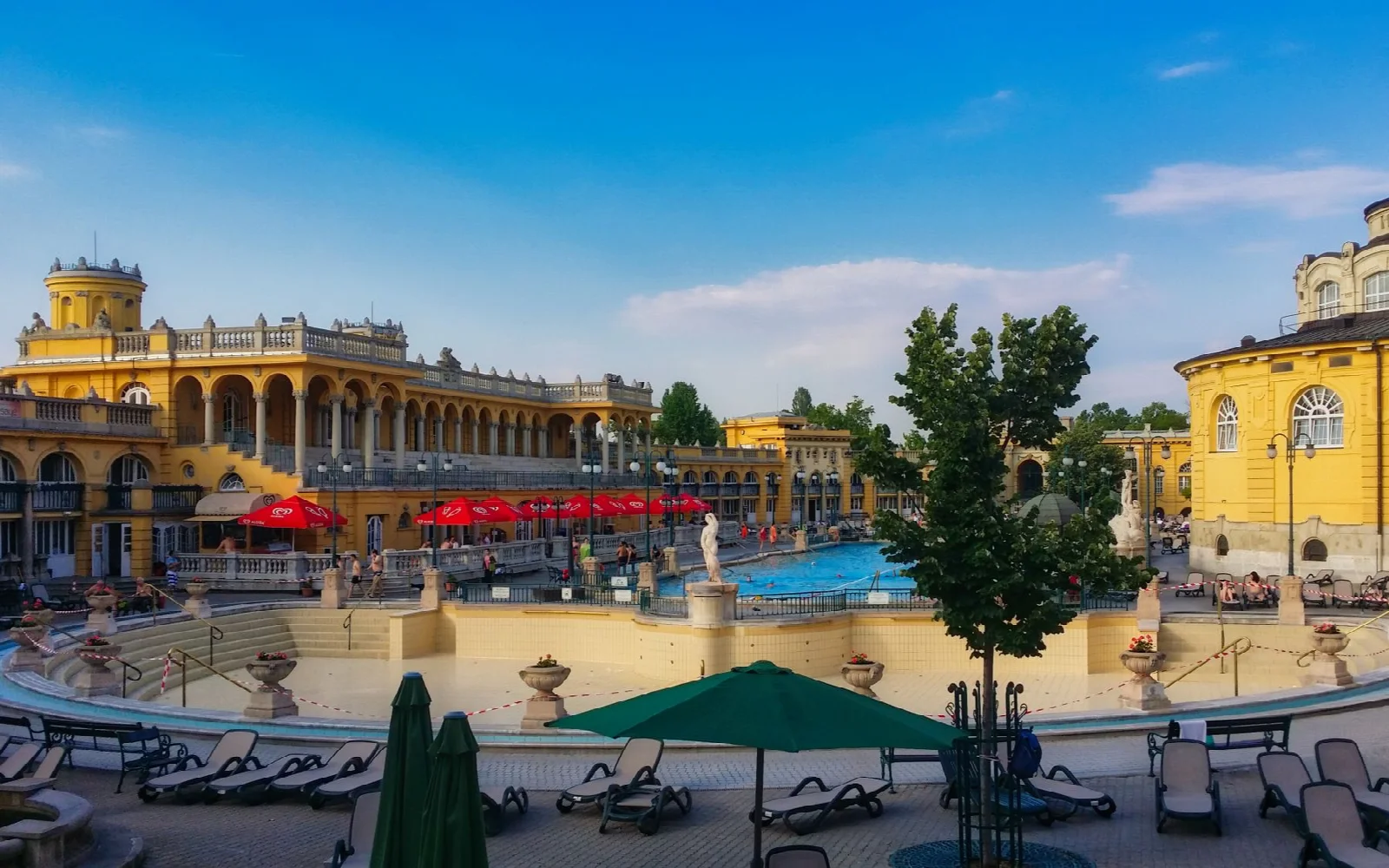 The historic architecture and outdoor pool area of Széchenyi Bath in Budapest