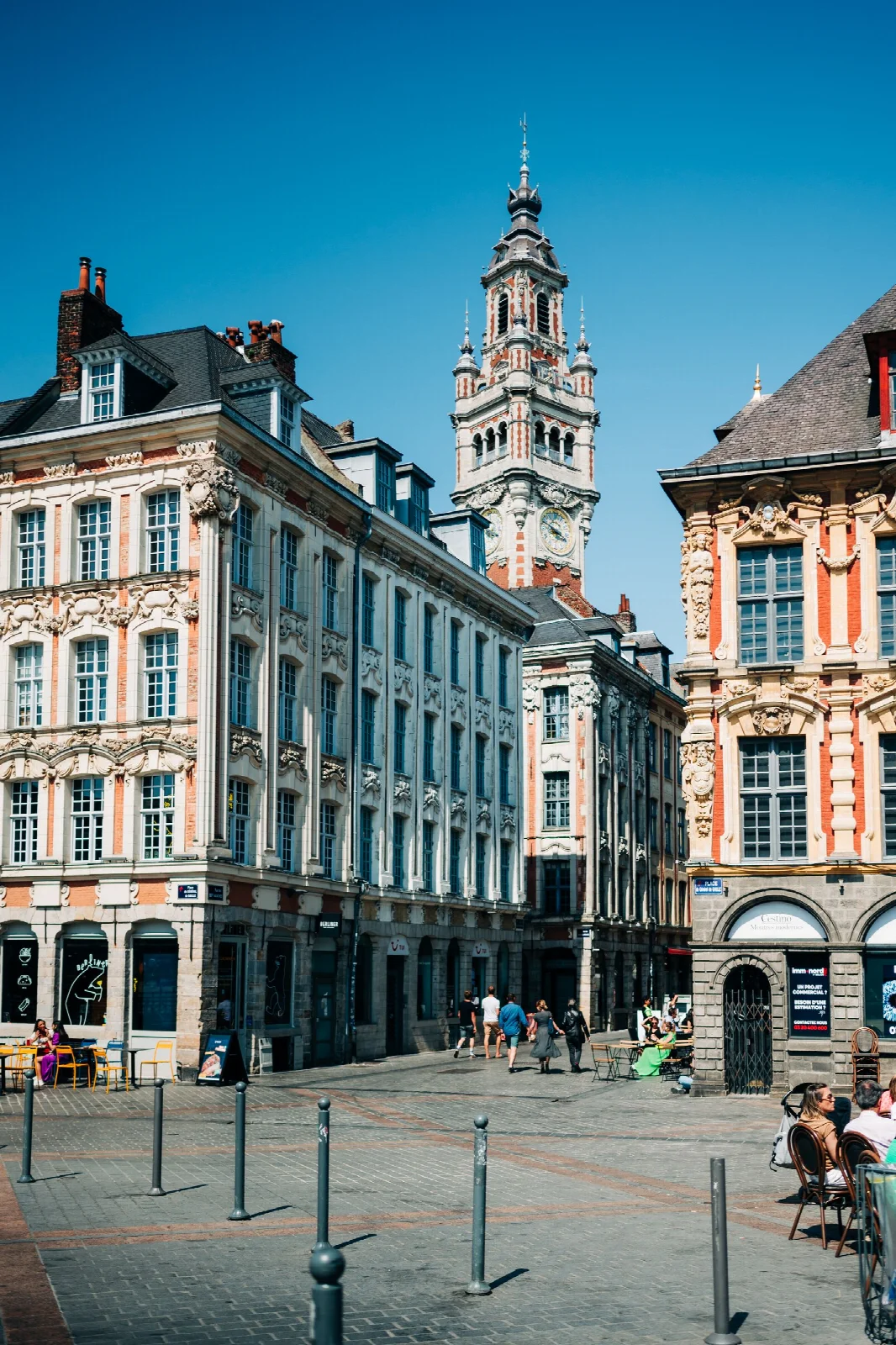 Historic facades and a clock tower around Grand Place in Lille