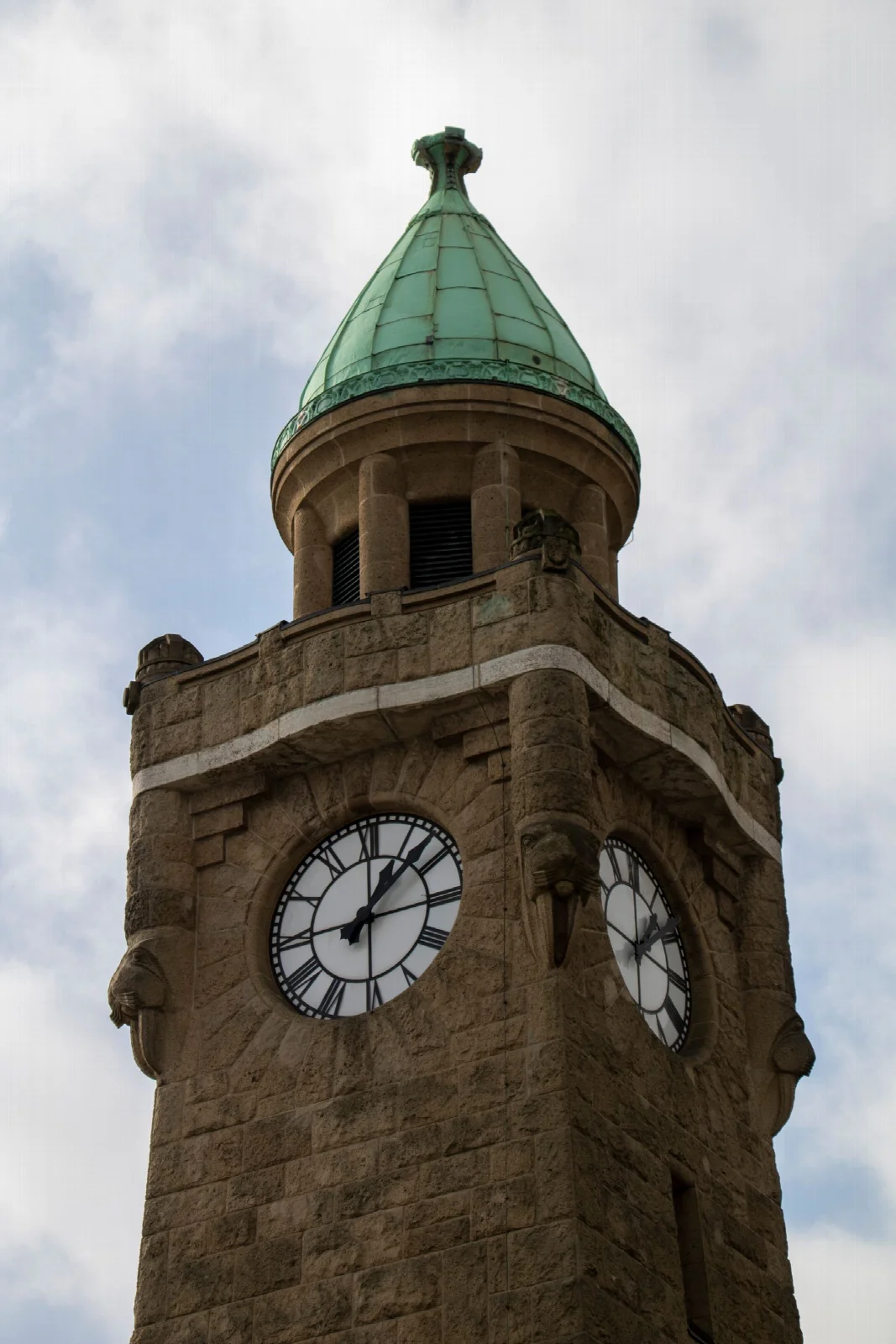 The historic clock tower at Hamburg Landungsbrücken piers