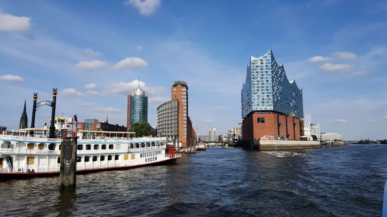 The Elbphilharmonie building and a boat on Hamburg harbour