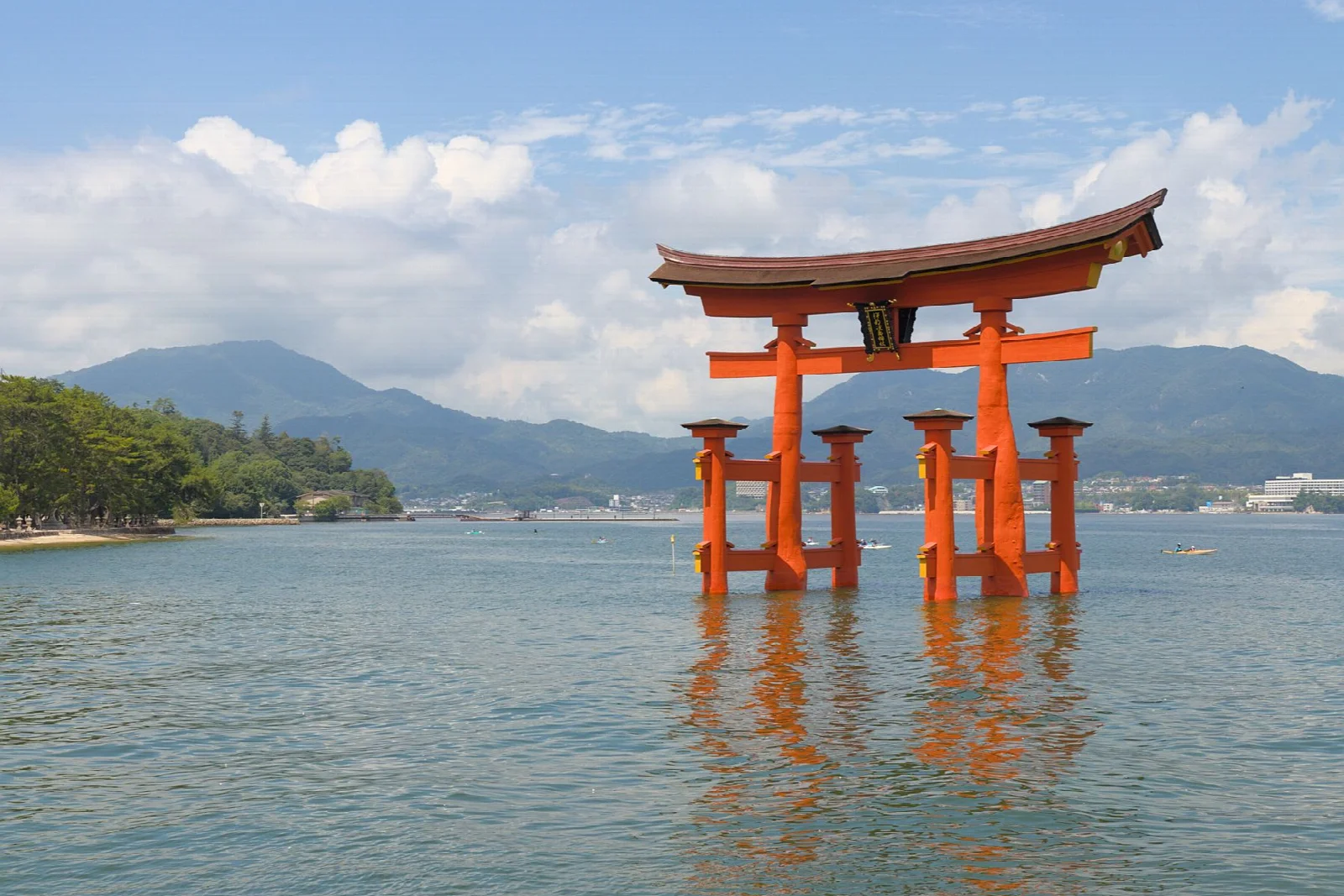 The red Itsukushima torii gate over the water at Miyajima