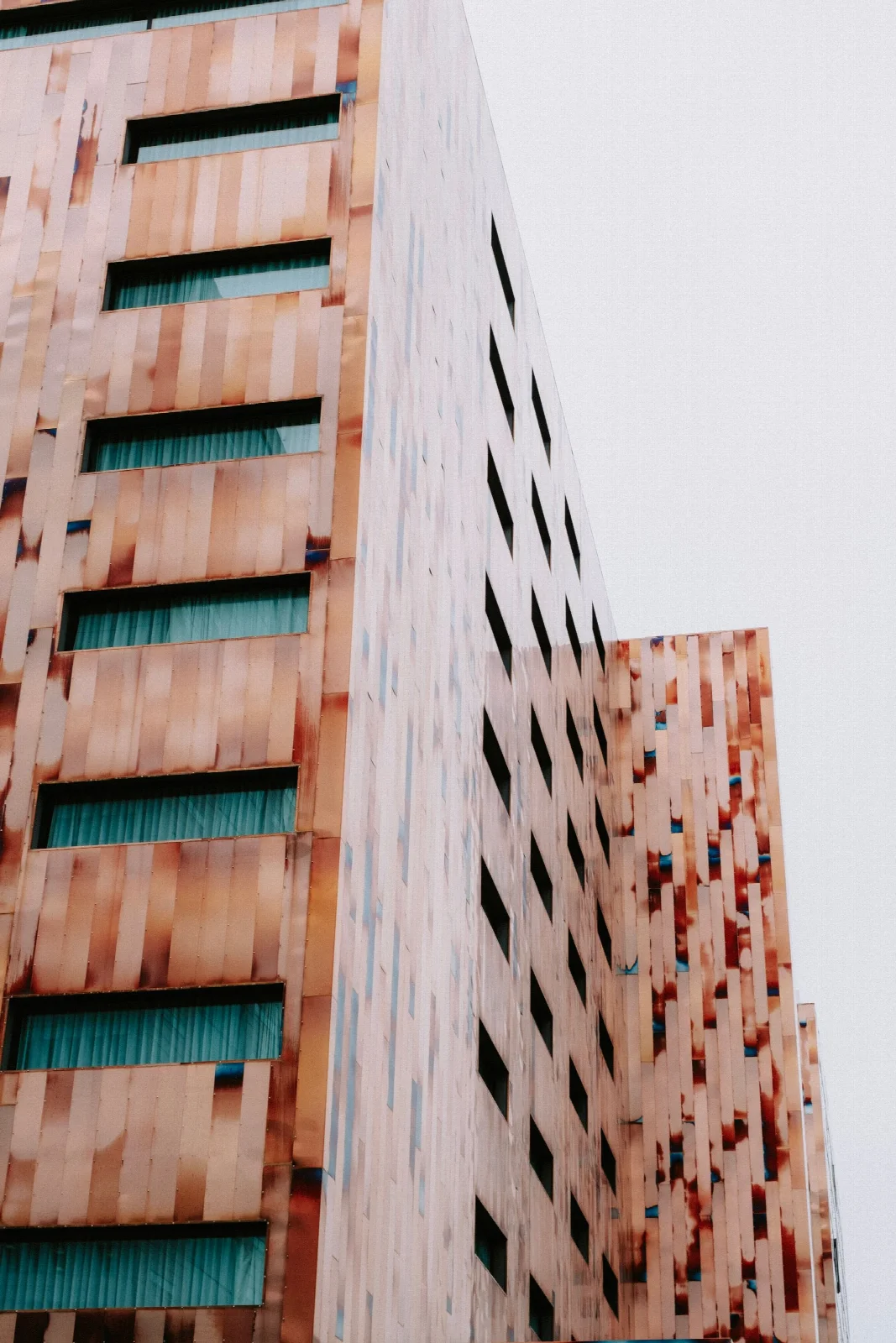 A copper-coloured modern high-rise in the Euralille area of Lille