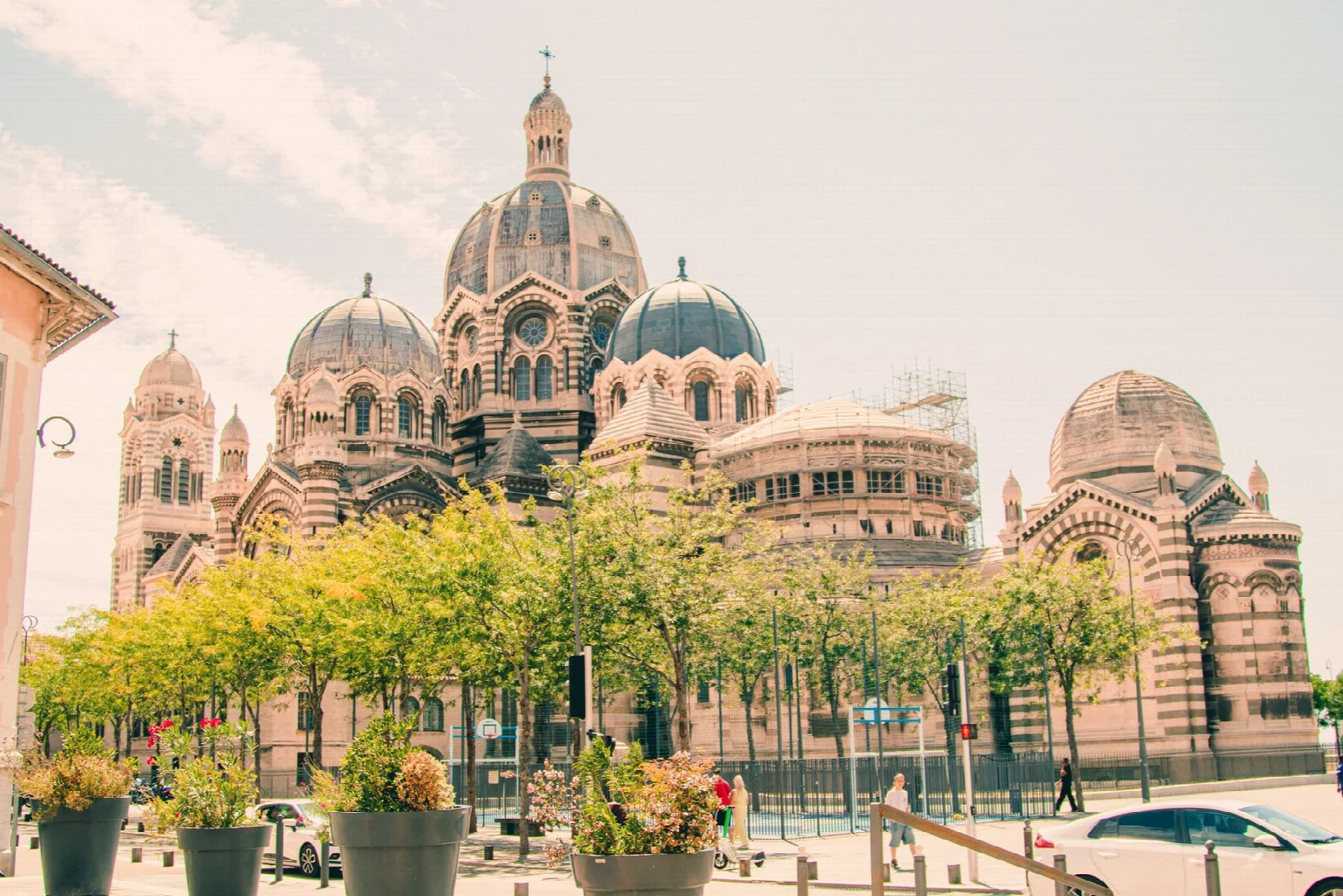 The domes of Marseille La Major Cathedral seen among trees