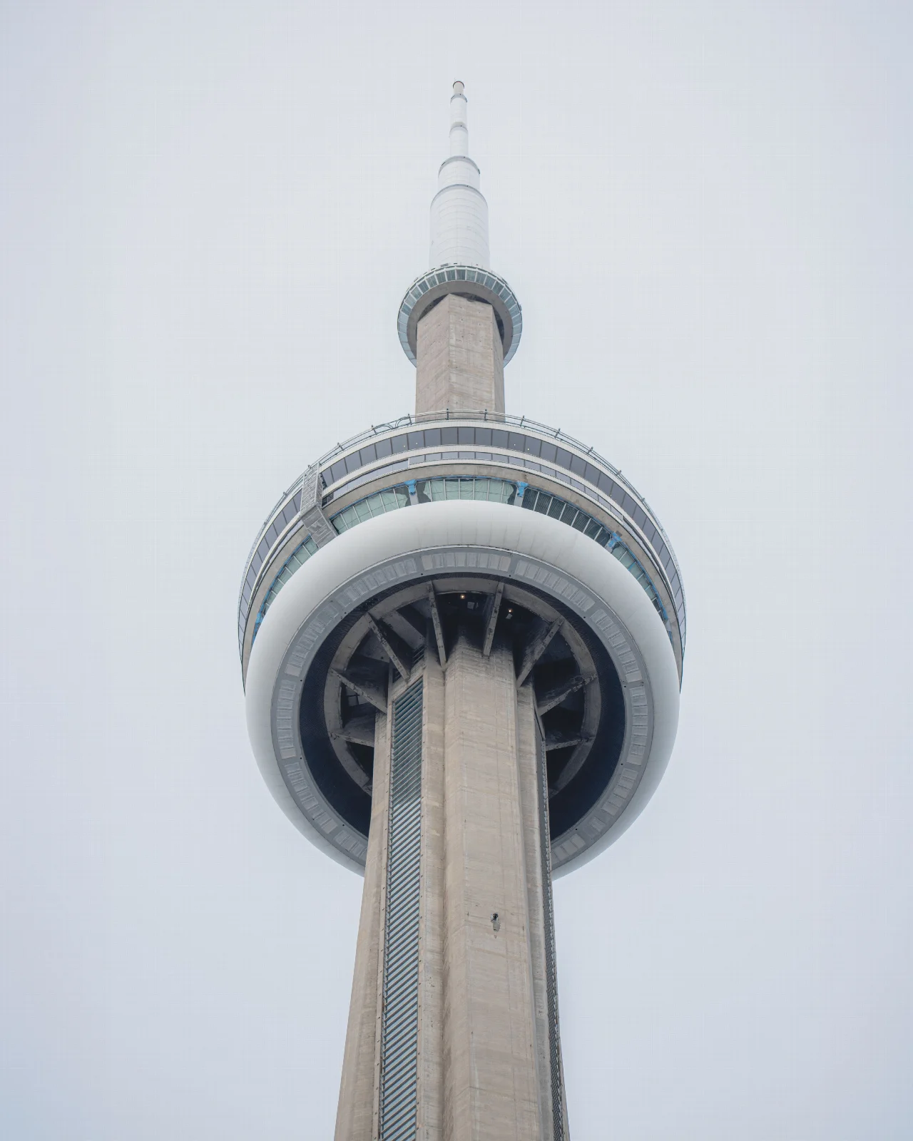 Looking up at the shaft and circular observation levels of Toronto’s CN Tower