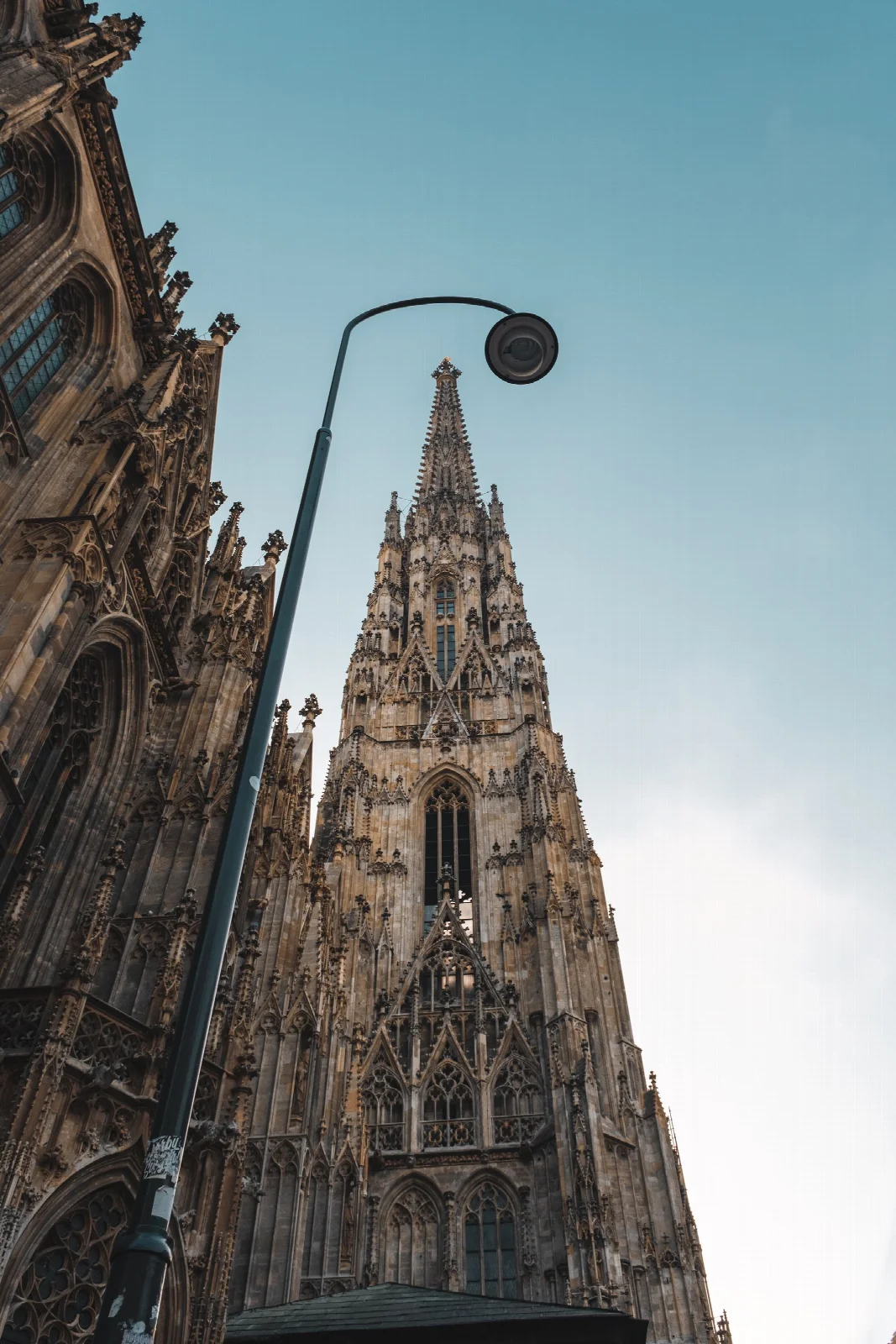 The Gothic tower and stone facade of St Stephen’s Cathedral in Vienna