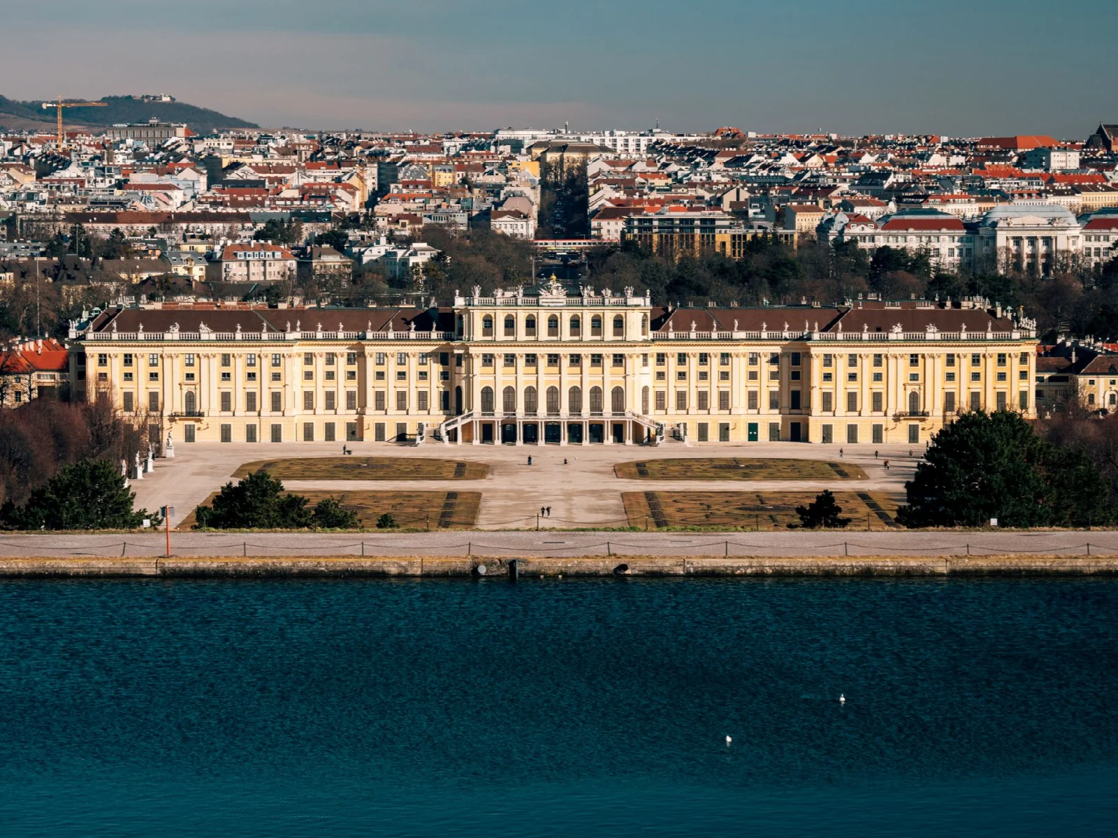 A broad view of Schönbrunn Palace, its gardens and the Vienna skyline